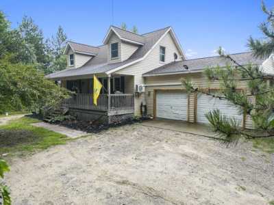 Home For Sale in Six Lakes, Michigan